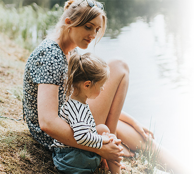 Hollister-mother-daughter-barefoot-on-bank-of-pond-onli-infyna-catheter